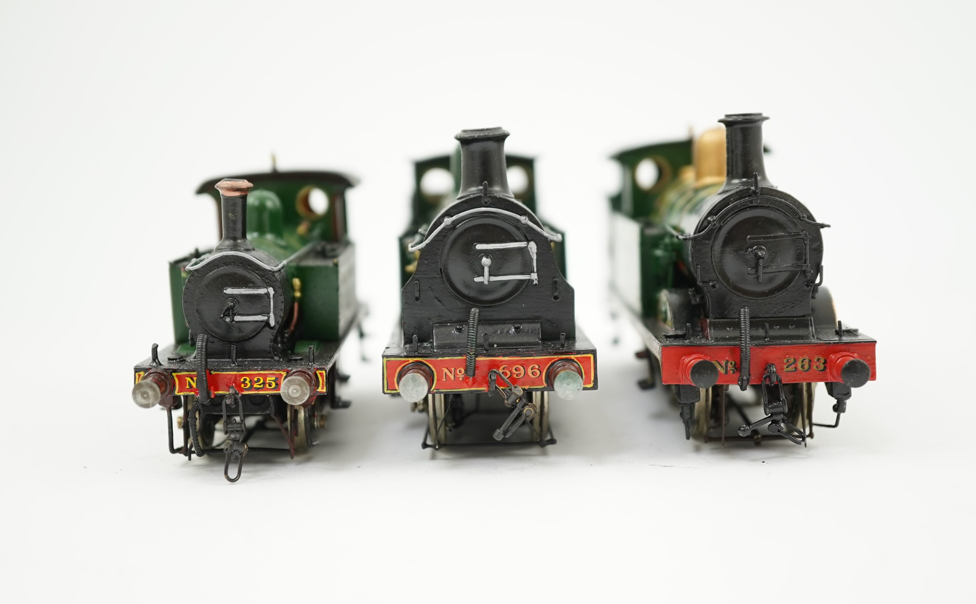 Three 00 gauge brass and white metal kit built Wainwright designed SE&CR tank locomotives (possibly by Wills Finecast); a class R1 0-4-4T, 696, a class H 0-4-4T, 263, and a class P 0-6-0T, 325, constructed, all painted a